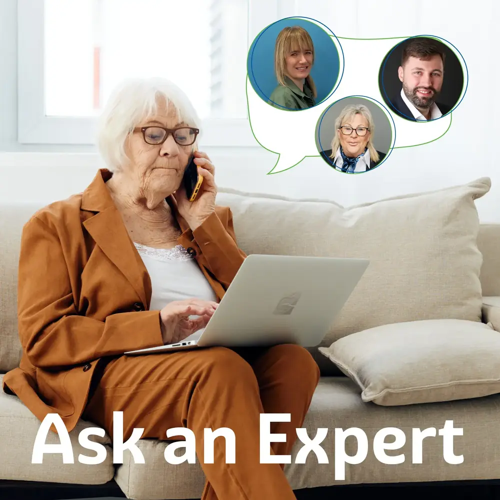 Elderly woman calling a live-in care expert